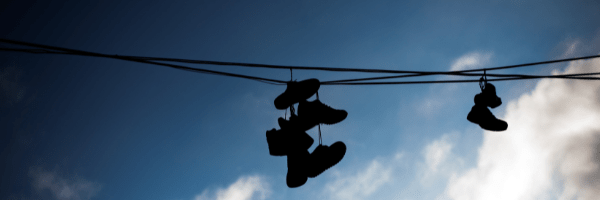 shoes hanging from powerlines